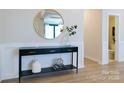 Elegant entryway with modern console table, stylish mirror, and sleek flooring at 50 Sherwood Nw Ct # Sw50, Concord, NC 28027