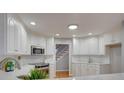 Stylish kitchen with white cabinets, stainless steel appliances, and modern countertops at 5306 Club View Dr, Concord, NC 28025