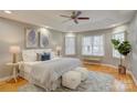 Spacious main bedroom features tray ceilings, hardwood floors, and plenty of natural light at 5306 Club View Dr, Concord, NC 28025
