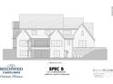 Rear exterior showcasing a balcony, stone details, multiple windows, and an entrance at 1121 Mesa Way # 43, Marvin, NC 28173