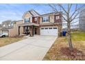 Attractive front exterior showcasing a two-story home with a well-maintained lawn at 12614 Chantrey Way, Huntersville, NC 28078