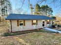 View of the home featuring newly installed roof, brick and wooden shutters at 134 Weaver Hill Dr, Statesville, NC 28625