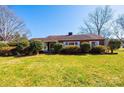 Charming brick home with manicured bushes, white trim, and a green lawn at 2375 E Nc 10 Hwy None, Conover, NC 28613
