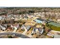 An aerial view showcases a neighborhood featuring a community pool and tennis courts at 252 Legend Dr, Rock Hill, SC 29732