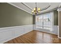 Inviting dining room with hardwood floors, large window with natural light, and classic trim at 252 Legend Dr, Rock Hill, SC 29732