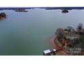 Stunning aerial view of the lakefront property with a private dock and serene water views at 2818 Cherry Ln, Denver, NC 28037