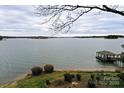 Picturesque lake view featuring a gazebo dock, perfect for relaxing and enjoying the waterfront at 2818 Cherry Ln, Denver, NC 28037