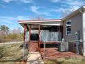 Back porch featuring privacy fence, stairs and easy access to air conditioning unit at 404 B And S Ln, Hickory, NC 28601