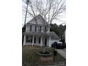 Beautiful two-story home with a well-kept lawn and a lovely tree in the front, enhancing its curb appeal at 610 Trillium Sw Ct # 14, Conover, NC 28613