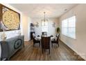 Bright dining room featuring wood floors, chandelier, and elegant decor at 9025 Remnick Dr, Gastonia, NC 28056