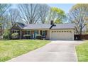 Inviting single-story brick home with a spacious driveway and meticulously landscaped yard at 119 Tara Ter, Kings Mountain, NC 28086