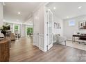 Bright and airy living room featuring hardwood floors, recessed lighting and an open concept layout at 1439 Hubert Graham Way, Tega Cay, SC 29708