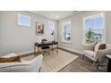 Comfortable home office with ample natural light, modern furnishings, and neutral decor at 1439 Hubert Graham Way, Tega Cay, SC 29708