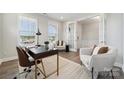 Bright office with large windows, modern furniture and light colored walls at 1439 Hubert Graham Way, Tega Cay, SC 29708