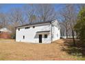 Renovated home featuring white brick, a new roof, and freshly landscaped yard at 244 Stilwell Oaks Cir, Charlotte, NC 28212