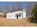 Renovated home featuring white brick, a new roof, and freshly landscaped yard at 244 Stilwell Oaks Cir, Charlotte, NC 28212
