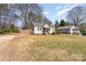 A cozy single-story home with a tidy front lawn and a classic suburban feel at 27 Liske Nw Ave, Concord, NC 28027