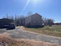 The rear of the house has an attached carport, providing convenient covered parking at 3032 Morning Glory Ln, Vale, NC 28168