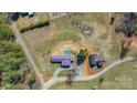 Panoramic aerial shot highlighting the property's layout, including buildings, driveways, and wooded areas at 4783 Rainey Ln, Maiden, NC 28650