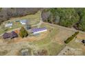 Expansive aerial view of the property, showcasing the house, outbuildings, and surrounding landscape at 4783 Rainey Ln, Maiden, NC 28650