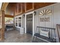 Inviting front porch featuring stylish décor, including a bench, chair, and decorative accents at 4783 Rainey Ln, Maiden, NC 28650