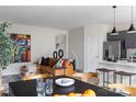 Open-concept living space with a modern kitchen, dining area, and comfortable seating at 7004 Matz Way, Charlotte, NC 28269
