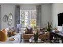 Cozy living room with neutral tones, large window, stylish decor and comfortable seating arrangement at 7012 Matz Way, Charlotte, NC 28269