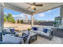 Covered outdoor patio featuring comfortable seating, string lights, and a ceiling fan at 7348 Adirondack Dr, Denver, NC 28037