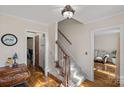 Inviting foyer with hardwood floors, stairs to the second level, and seamless access to living areas at 7824 Hickory Stick Pl, Charlotte, NC 28277