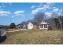 Lovely exterior view showcasing the home's tidy yard and neighborhood setting on a bright, sunny day at 839 Prestwick Dr, Rock Hill, SC 29730
