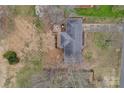 Bird's-eye view of a home with a deck and outdoor seating in a well-landscaped backyard at 107 Pinelake Dr, Kings Mountain, NC 28086