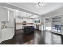 Bright kitchen featuring white cabinetry, granite countertops, a center island, and stainless steel appliances at 1122 Hartmann Ct, Fort Mill, SC 29715