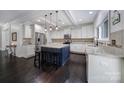 Bright kitchen featuring white cabinetry, granite countertops, a center island with pendant lighting at 1122 Hartmann Ct, Fort Mill, SC 29715