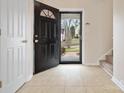 Welcoming foyer with neutral tile flooring, front door, and view of the home's exterior at 13108 Rothe House Rd # 167, Charlotte, NC 28273