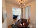 Cozy dining area with modern lighting, open to the living room, perfect for entertaining guests at 1315 East Blvd # 328, Charlotte, NC 28203