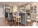 An open kitchen with granite countertops, stainless steel appliances, and stylish island seating at 1708 Royal Gorge Ave, Charlotte, NC 28210