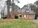 Charming single-story home featuring tan siding, red shutters, and an attached one car garage at 2517 Bushy Pine Ct, Charlotte, NC 28273