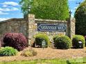 Stone community entrance sign for Savannah Way, surrounded by manicured landscaping at 3300 Savannah Way, Monroe, NC 28110