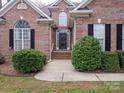 Charming brick home featuring a well-maintained front yard and inviting entrance at 3300 Savannah Way, Monroe, NC 28110