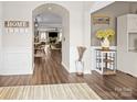 Inviting entryway with wood floors and arched doorways, offering a glimpse into the home's layout at 3549 Sandy E Trl, Fort Mill, SC 29707