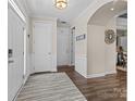 Inviting entryway featuring wood floors, modern lighting and a welcoming atmosphere at 3549 Sandy E Trl, Fort Mill, SC 29707