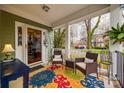 Cozy front porch featuring seating, a colorful rug, and charming decor at 433 Runnymede Dr, Rock Hill, SC 29732