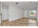 Bright living room boasts hardwood floors and a large window for ample natural light at #603 Mt. Mitchell Ave # 603, Gastonia, NC 28052