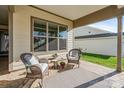 Relaxing outdoor patio with comfortable seating and a neutral rug at 7127 Hanging Rock Ct, Denver, NC 28037