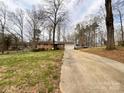 Long driveway leading to a well-maintained brick home, offering privacy and ample parking space for multiple vehicles at 905 Kemper Cir, Rock Hill, SC 29732