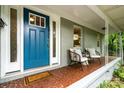 Inviting front porch with two chairs, perfect for enjoying the outdoors at 917 Bobby Ln, Charlotte, NC 28211