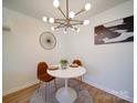 Modern dining area with stylish lighting, a round table, and two chairs, ideal for intimate meals at 1057 Farm Pond Ln, Rock Hill, SC 29732