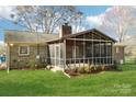 Enjoy the outdoors in this screened-in porch, perfect for entertaining and relaxation at 108 Colonial Dr, Kings Mountain, NC 28086