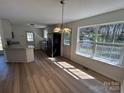 Spacious kitchen with updated appliances, including stainless steel refrigerator, granite counters, and ample natural light at 2190 Pacer Rd, Lancaster, SC 29720