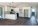 Kitchen features stainless appliances, white cabinets, granite counter tops, and hardwood floors at 2200 Clay St # 2, Kannapolis, NC 28083